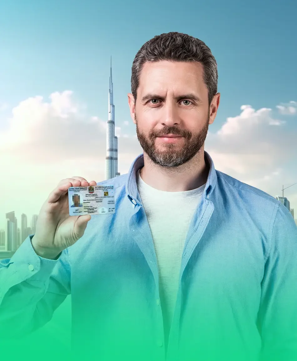 Man holding Emirates ID with Dubai skyline background