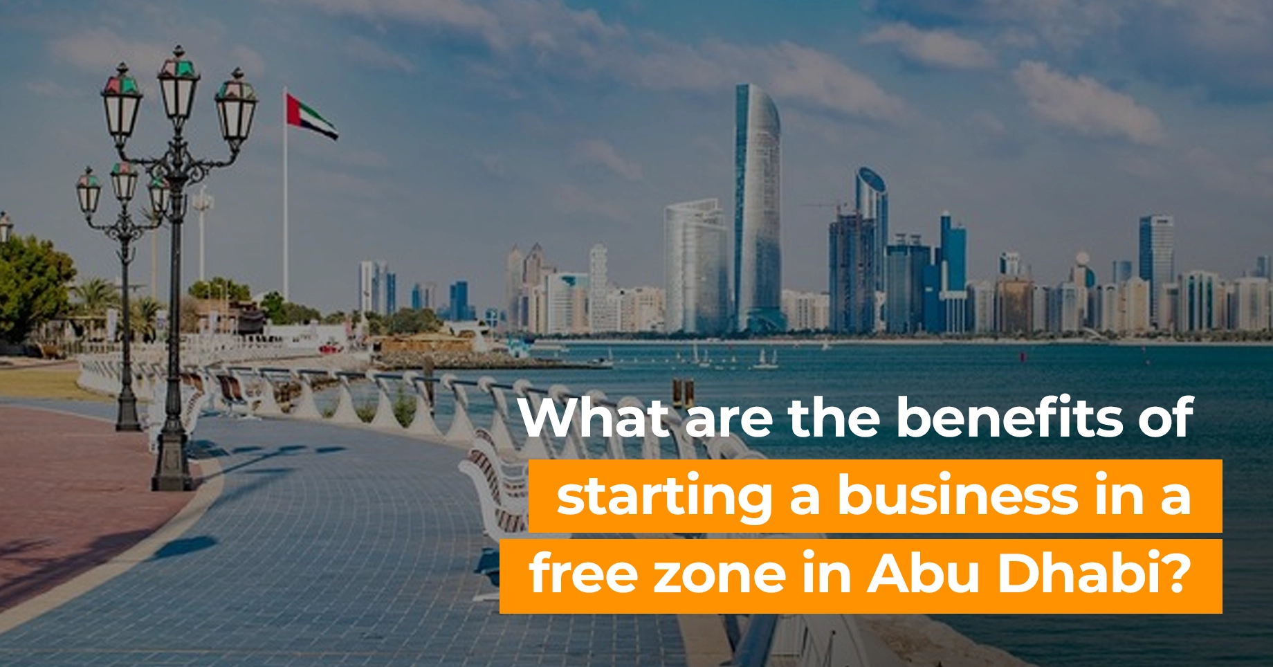 What are the benefits of starting a business in a free zone in Abu Dhabi?