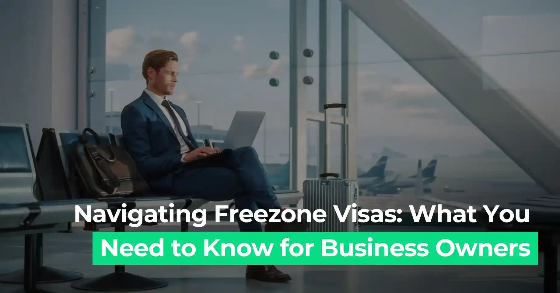 Businessman using laptop at airport lounge representing UAE freezone visa guide for entrepreneurs and business owners in 2025.